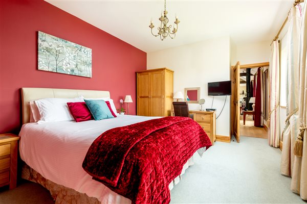 King bedroom with oak furniture